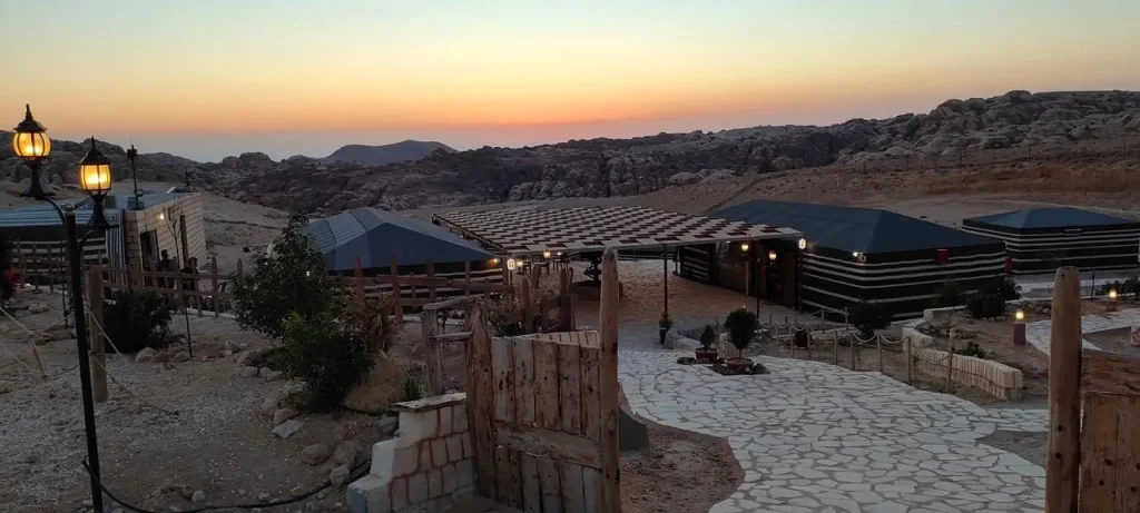 Panorama of Petra Wassaif Camp and the surrounding mountains at sunset