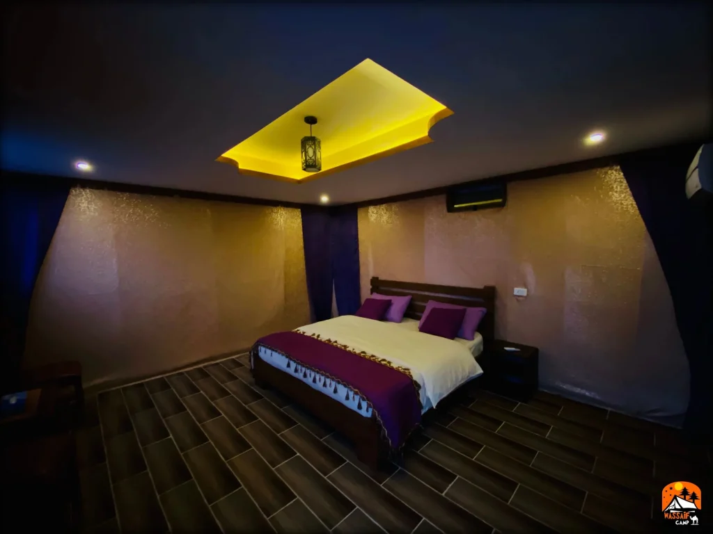 King size bed room at Petra Wassaif Camp with private en-suite and air conditioning