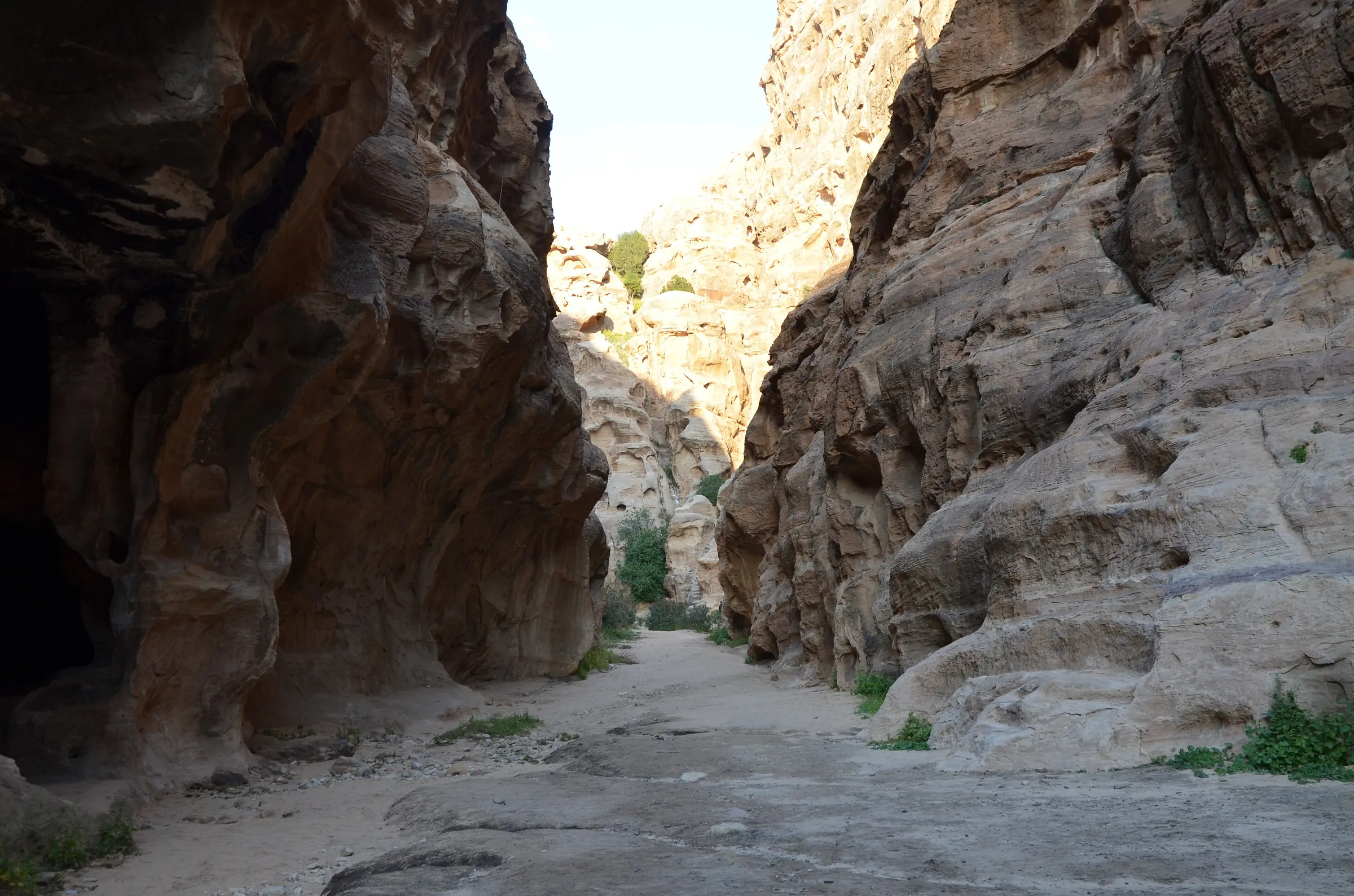 Carved Nabataean facade among sandstone boulders at Little Petra (Siq al-Barid)