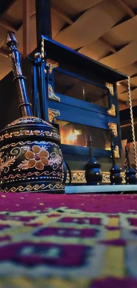 Traditional Arabic coffee pot beside the lobby fireplace